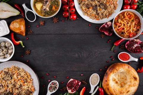The concept of Eastern festive cuisine. Assorted Uzbek food set, pilaf, samsa Stock Photos