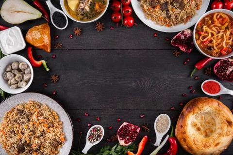 The concept of Eastern festive cuisine. Assorted Uzbek food set, pilaf, samsa Stock Photos