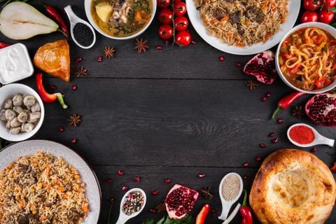 The concept of Eastern festive cuisine. Assorted Uzbek food set, pilaf, samsa Stock Photos