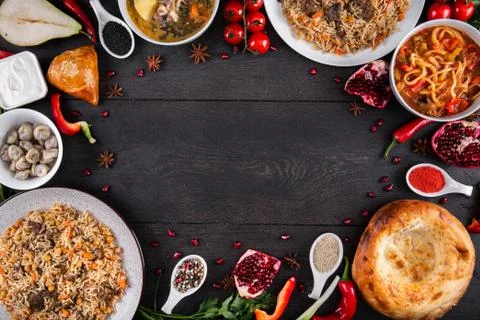 The concept of Eastern festive cuisine. Assorted Uzbek food set, pilaf, samsa Stock Photos