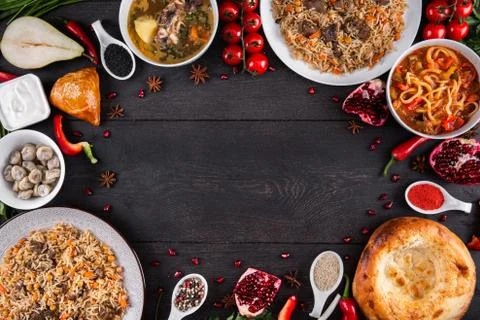 The concept of Eastern festive cuisine. Assorted Uzbek food set, pilaf, samsa Stock Photos