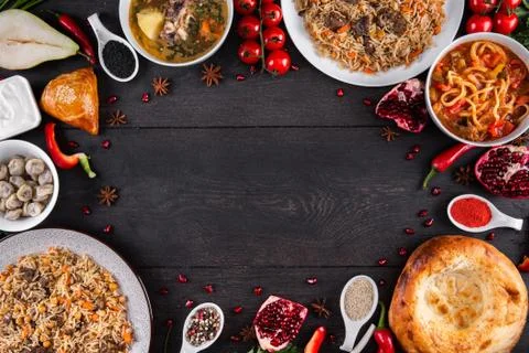 The concept of Eastern festive cuisine. Assorted Uzbek food set, pilaf, samsa Stock Photos