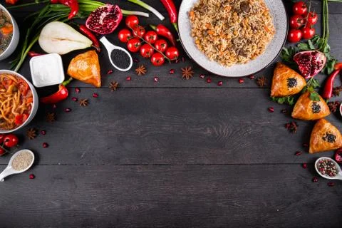 The concept of Eastern festive cuisine. Assorted Uzbek food set, pilaf, samsa Stock Photos