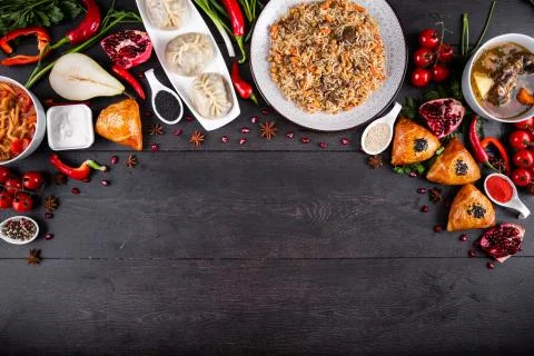 The concept of Eastern festive cuisine. Assorted Uzbek food set, pilaf, samsa Stock Photos