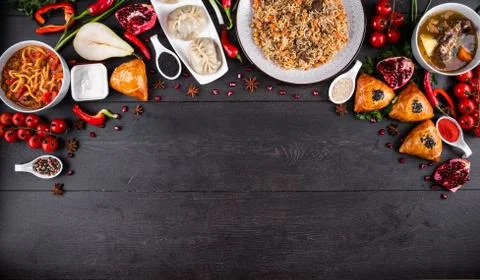The concept of Eastern festive cuisine. Assorted Uzbek food set, pilaf, samsa Stock Photos