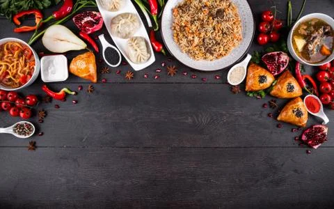 The concept of Eastern festive cuisine. Assorted Uzbek food set, pilaf, samsa Stock Photos