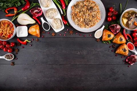 The concept of Eastern festive cuisine. Assorted Uzbek food set, pilaf, samsa Stock Photos