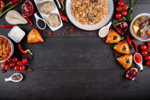 The concept of Eastern festive cuisine. Assorted Uzbek food set, pilaf, samsa Stock Photos