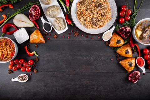 The concept of Eastern festive cuisine. Assorted Uzbek food set, pilaf, samsa Stock Photos