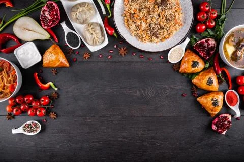 The concept of Eastern festive cuisine. Assorted Uzbek food set, pilaf, samsa Stock Photos