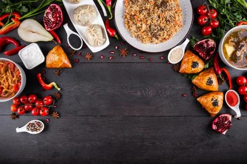 The concept of Eastern festive cuisine. Assorted Uzbek food set, pilaf, samsa Stock Photos