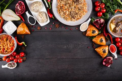 The concept of Eastern festive cuisine. Assorted Uzbek food set, pilaf, samsa Stock Photos