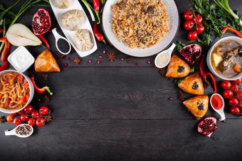 The concept of Eastern festive cuisine. Assorted Uzbek food set, pilaf, samsa Stock Photos