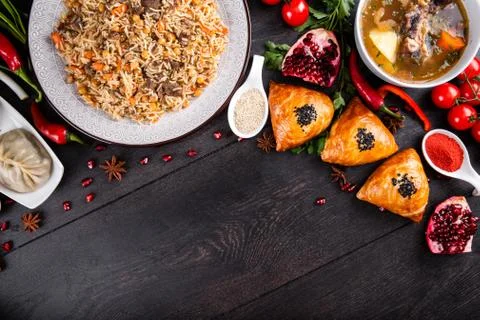 The concept of Eastern festive cuisine. Assorted Uzbek food set, pilaf, samsa Stock-Fotos