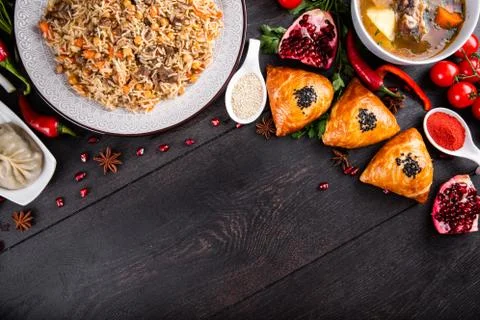 The concept of Eastern festive cuisine. Assorted Uzbek food set, pilaf, samsa Stock Photos