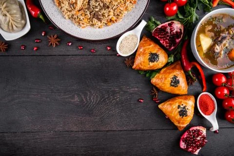The concept of Eastern festive cuisine. Assorted Uzbek food set, pilaf, samsa Stock-Fotos