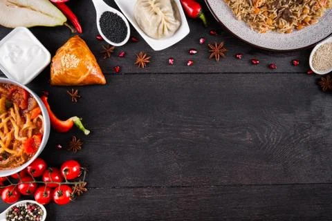 The concept of Eastern festive cuisine. Assorted Uzbek food set, pilaf, samsa Stock Photos