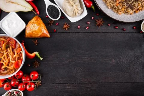 The concept of Eastern festive cuisine. Assorted Uzbek food set, pilaf, samsa Stock Photos