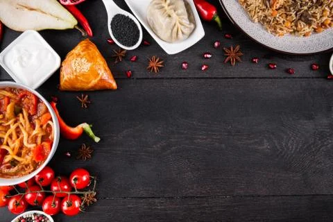 The concept of Eastern festive cuisine. Assorted Uzbek food set, pilaf, samsa Stock Photos