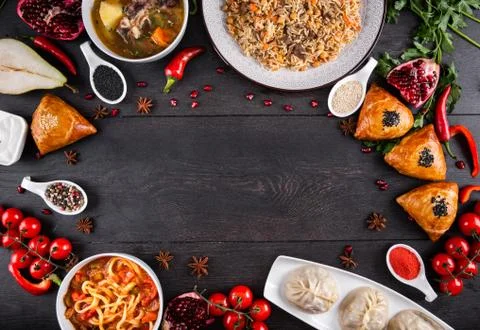 The concept of Eastern festive cuisine. Assorted Uzbek food set, pilaf, samsa Stock Photos