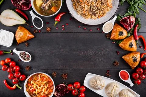 The concept of Eastern festive cuisine. Assorted Uzbek food set, pilaf, samsa Stock Photos