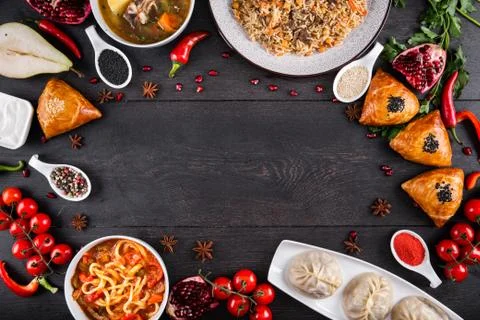 The concept of Eastern festive cuisine. Assorted Uzbek food set, pilaf, samsa Stock Photos