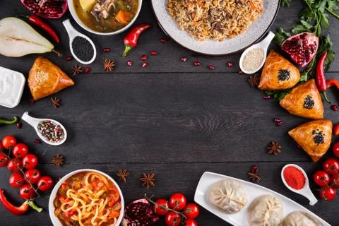 The concept of Eastern festive cuisine. Assorted Uzbek food set, pilaf, samsa Stock Photos