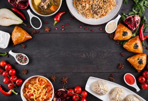 The concept of Eastern festive cuisine. Assorted Uzbek food set, pilaf, samsa Stock Photos