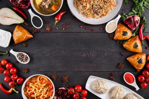The concept of Eastern festive cuisine. Assorted Uzbek food set, pilaf, samsa Stock Photos