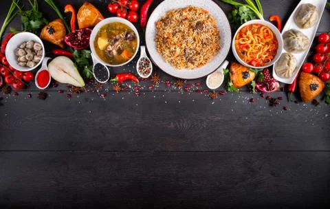 The concept of Eastern festive cuisine. Assorted Uzbek food set, pilaf, samsa Stock Photos