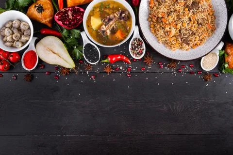 The concept of Eastern festive cuisine. Assorted Uzbek food set, pilaf, samsa Stock Photos