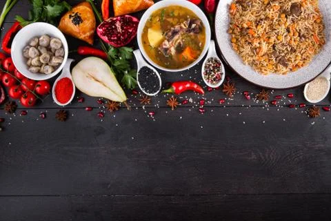 The concept of Eastern festive cuisine. Assorted Uzbek food set, pilaf, samsa Stock Photos