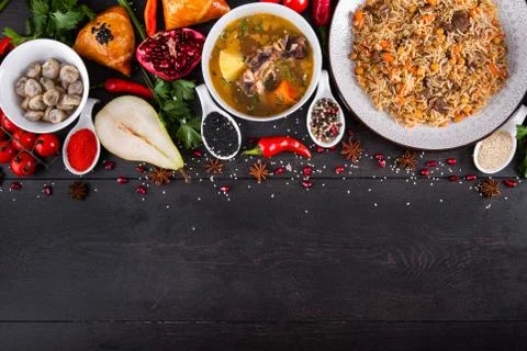 The concept of Eastern festive cuisine. Assorted Uzbek food set, pilaf, samsa Stock Photos
