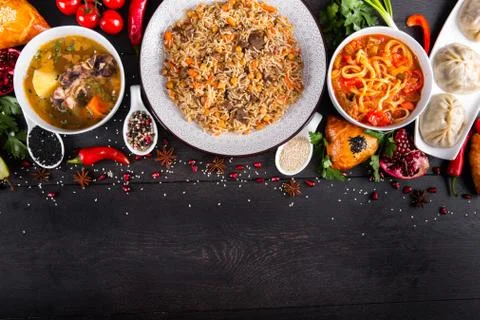 The concept of Eastern festive cuisine. Assorted Uzbek food set, pilaf, samsa Stock Photos