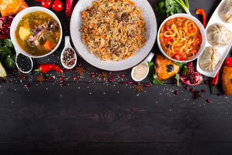 The concept of Eastern festive cuisine. Assorted Uzbek food set, pilaf, samsa Stock Photos