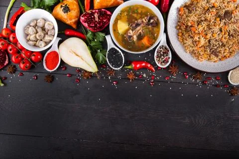 The concept of Eastern festive cuisine. Assorted Uzbek food set, pilaf, samsa Stock Photos