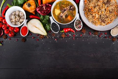 The concept of Eastern festive cuisine. Assorted Uzbek food set, pilaf, samsa Stock Photos