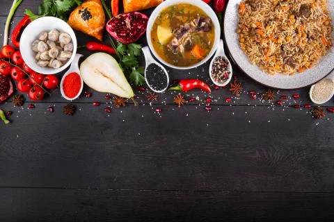 The concept of Eastern festive cuisine. Assorted Uzbek food set, pilaf, samsa Stock-Fotos