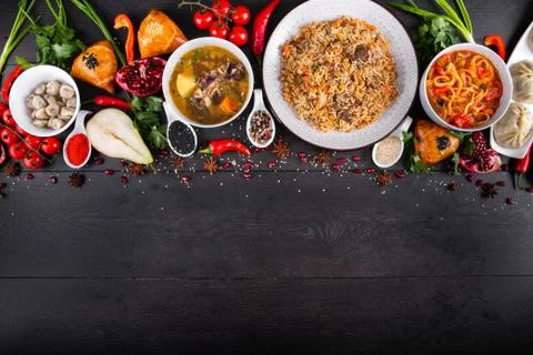 The concept of Eastern festive cuisine. Assorted Uzbek food set, pilaf, samsa Stock Photos