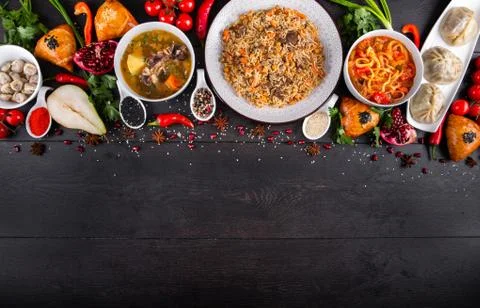 The concept of Eastern festive cuisine. Assorted Uzbek food set, pilaf, samsa Stock Photos