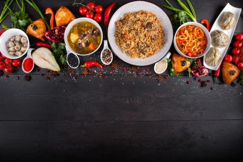 The concept of Eastern festive cuisine. Assorted Uzbek food set, pilaf, samsa Stock Photos