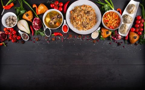 The concept of Eastern festive cuisine. Assorted Uzbek food set, pilaf, samsa Stock Photos