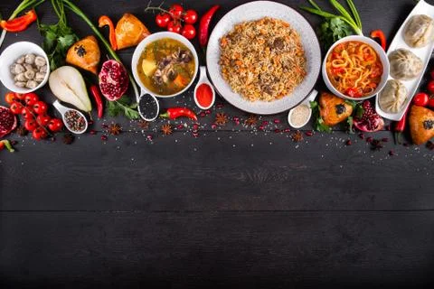 The concept of Eastern festive cuisine. Assorted Uzbek food set, pilaf, samsa Stock Photos