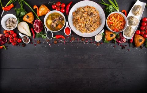 The concept of Eastern festive cuisine. Assorted Uzbek food set, pilaf, samsa Stock Photos