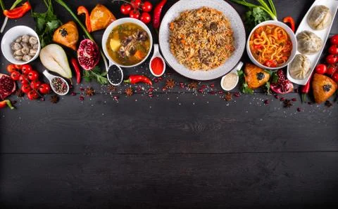 The concept of Eastern festive cuisine. Assorted Uzbek food set, pilaf, samsa Stock-Fotos