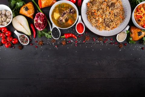 The concept of Eastern festive cuisine. Assorted Uzbek food set, pilaf, samsa Stock Photos