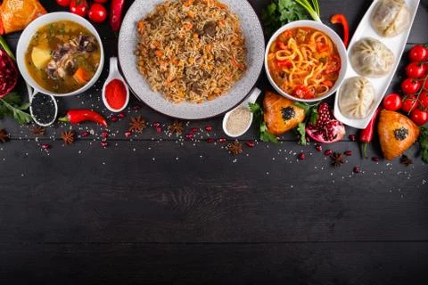 The concept of Eastern festive cuisine. Assorted Uzbek food set, pilaf, samsa Stock Photos