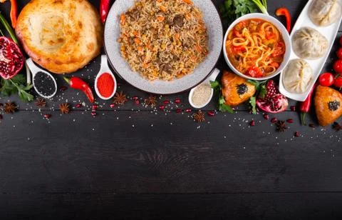 The concept of Eastern festive cuisine. Assorted Uzbek food set, pilaf, samsa Stock Photos