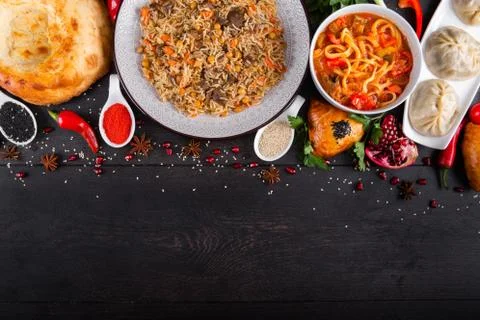 The concept of Eastern festive cuisine. Assorted Uzbek food set, pilaf, samsa Stock Photos