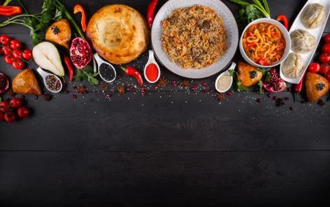 The concept of Eastern festive cuisine. Assorted Uzbek food set, pilaf, samsa Stock Photos